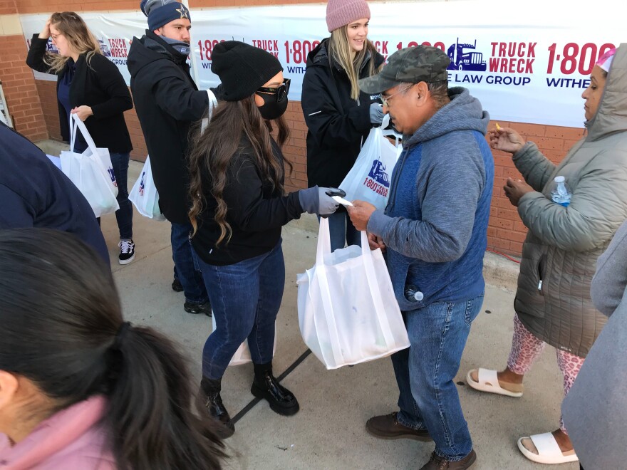  At a turkey giveaway in Fort Worth's Stop Six neighborhood, people started lining up early to take home one of 1,000 frozen turkeys. 