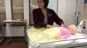 Professor Deborah Spoerner demonstrates a model in the Purdue Nursing School's new simulation lab.