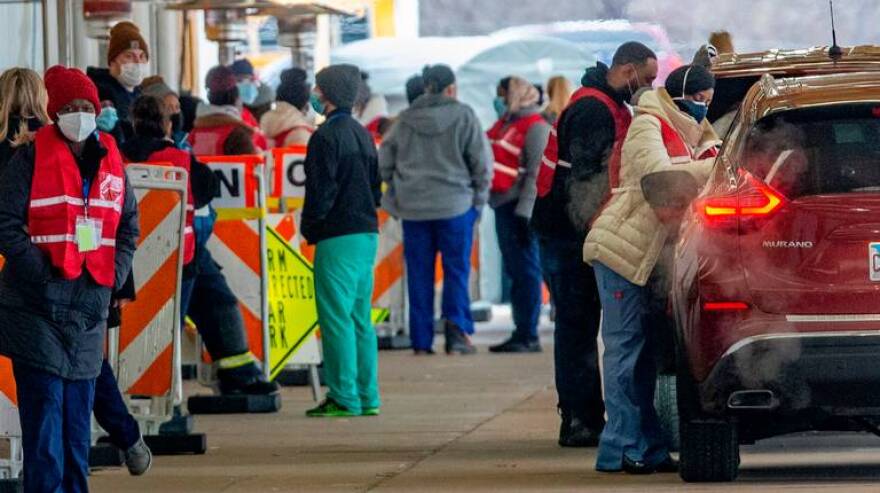 Cars pull up for COVID-19 vaccinations at Belle-Clair Fairgrounds in Belleville on Feb. 1, the first day for a drive-thru clinic operated by St. Clair County agencies with help from the National Guard. On Friday, nearly 80% of the appointments were taken by people as far away as California.