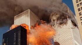 FILE - Smoke billows from one of the towers of the World Trade Center and flames and debris explode from the second tower in New York, Sept. 11, 2001. (AP Photo/Chao Soi Cheong, File)
