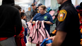 The Meriden Firefighter 1148 organized a back-to-school event on August 25, 2023 to help children grades K to 8th with school supplies. Beth Dunn, Deputy chief Ryan Dunn’s wife, volunteers to hand out back packs to Meriden families.