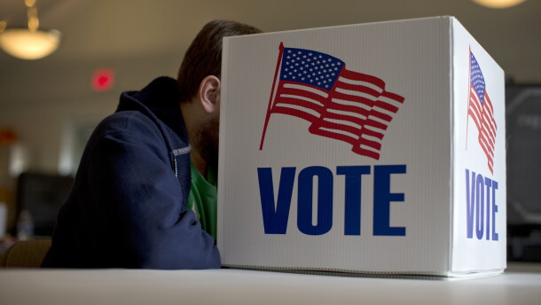 A voter fills our a provisional ballot by hand for the midterm elections at a polling place in Annapolis, Md.