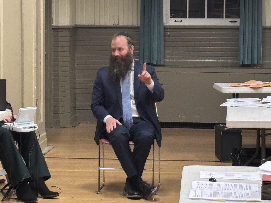 Rabbi Benny Rapoport speaks to people at the Waverly Community House on Nov. 14.