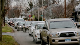 A line of cars wait to receive COVID-19 test kits at the Wethersfield High School. The city website announced that the distribution would begin at 10 a.m., but cars lined up at 6:30 in the morning.