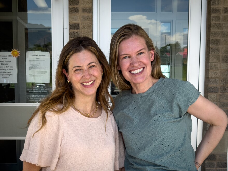 Heather Santos and Teresa Anderson-Myers, co-founders of SLC Pursuit Co., stand outside of East High School in Salt Lake City, July 20, 2026.