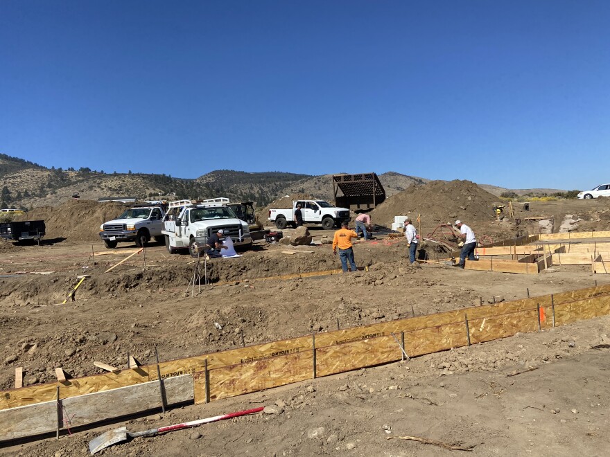  A construction crew works on the foundation of a custom home in the wildland-urban interface in Reno, Nev., on Oct. 12, 2022.