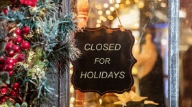 Closed for Christmas holidays, New Year vacations. text on signboard, board on window of cafe, shop, store in winter. High quality photo