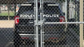 The former police chief of Godley is accused of sexual assault, stalking and collaborating with a local couple to compile information on people they saw as adversaries.