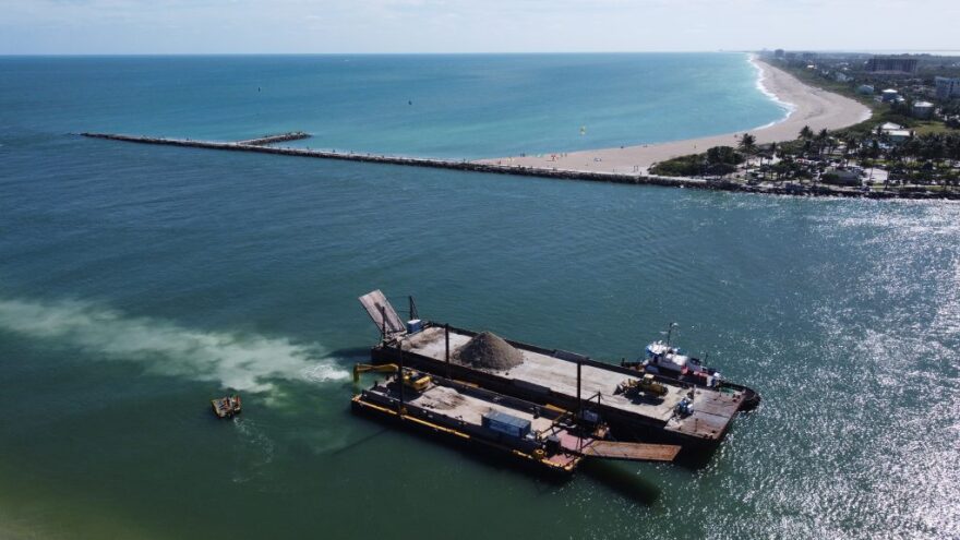 A barge carrying sand