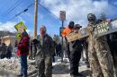 People protest Tuesday, Feb. 18, 2025, outside of Woodbourne Correctional in Sullivan County.