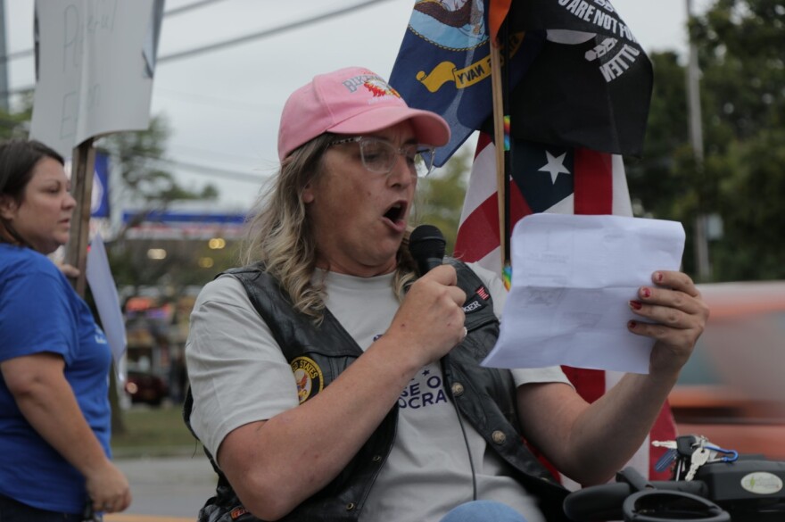 Protester Dianna Patton leads chants outside the Erie County Moms for Liberty meeting in West Seneca Sept. 6, 2022.