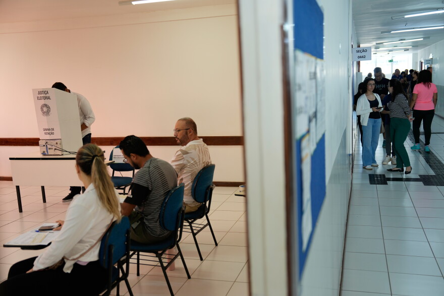 A casts his ballot using electronic voting machines during general elections in Brasilia, Brazil, Sunday, Oct. 4, 2026.