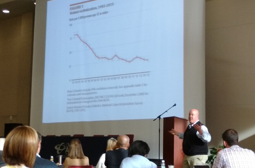 Criminologist Michael Turner of UNC Charlotte showed a slide about the decline in violent crime over the past two decades. 