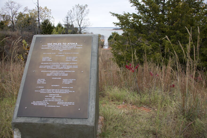 A plaque at the end of the Atoka Pipeline, where it meets Lake Stanley Draper. 
