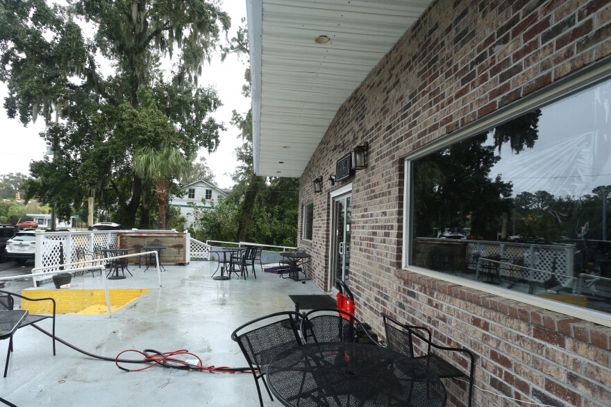 The outside patio area of Willie's Bar and Grill in St Helena Island, S.C. after a shooting occurred early Sunday, Oct. 12, 2025. (AP Photo/Lewis M. Levine)