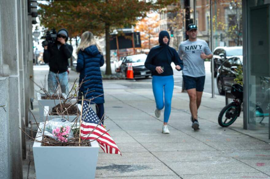 Flowers and an American flag, placed at the scene a day after two National Guard soldiers were shot near the White House in Washington, Thursday, Nov. 27, 2025. (Cliff Owen/AP)