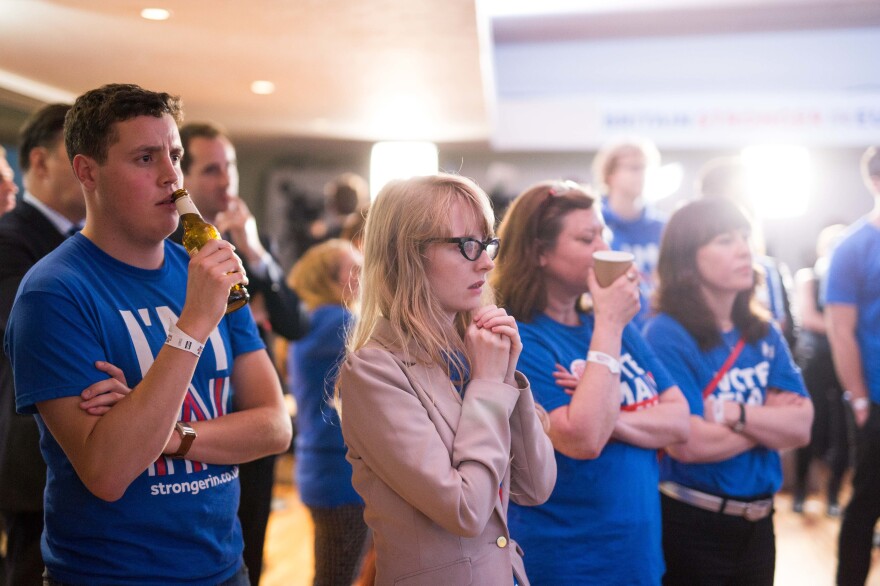 Supporters of the Stronger In campaign, which advocated for remaining in the EU, watch the results of the EU referendum being announced at London's Royal Festival Hall on Friday. Voters opted to leave the European Union.