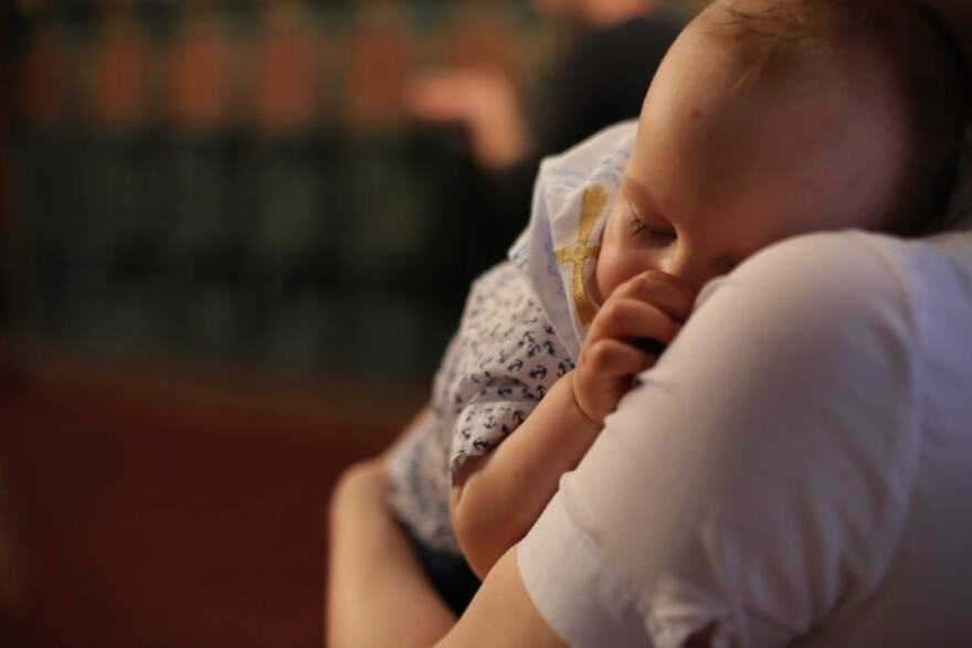 An infant sleeping.