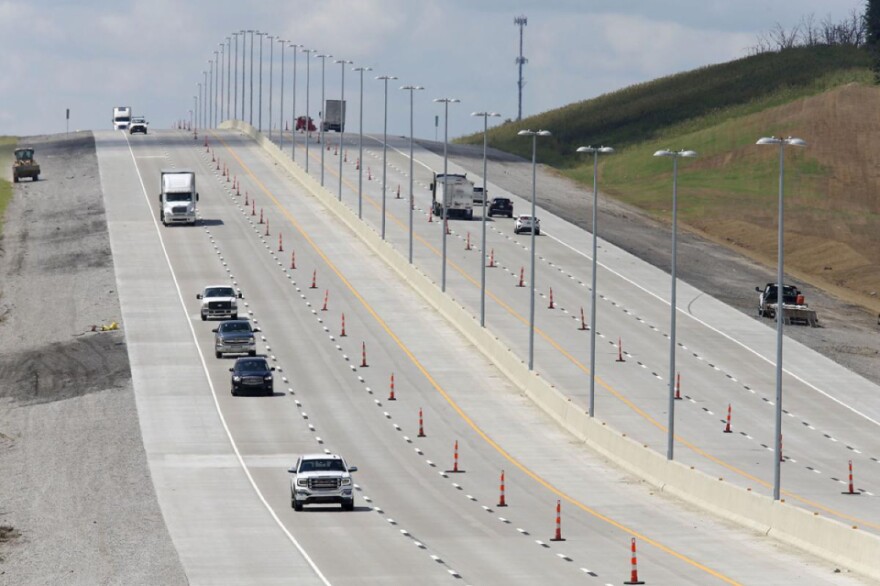  Drivers travel a widened section of the Turner Turnpike.