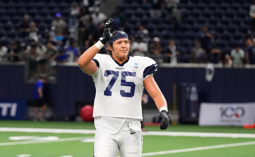 FILE - Dallas Cowboys offensive tackle Shiyazh Pete waves to fans after an NFL football practice on Aug. 26, 2026, in Frisco, Texas. (AP Photo/Tony Gutierrez, File)