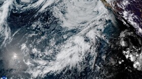 This satellite image shows two Pacific weather disturbances southeast of Hawaiʻi that are expected to form into tropical cyclones within the next two days, according to the Central Pacific Hurricane Center.