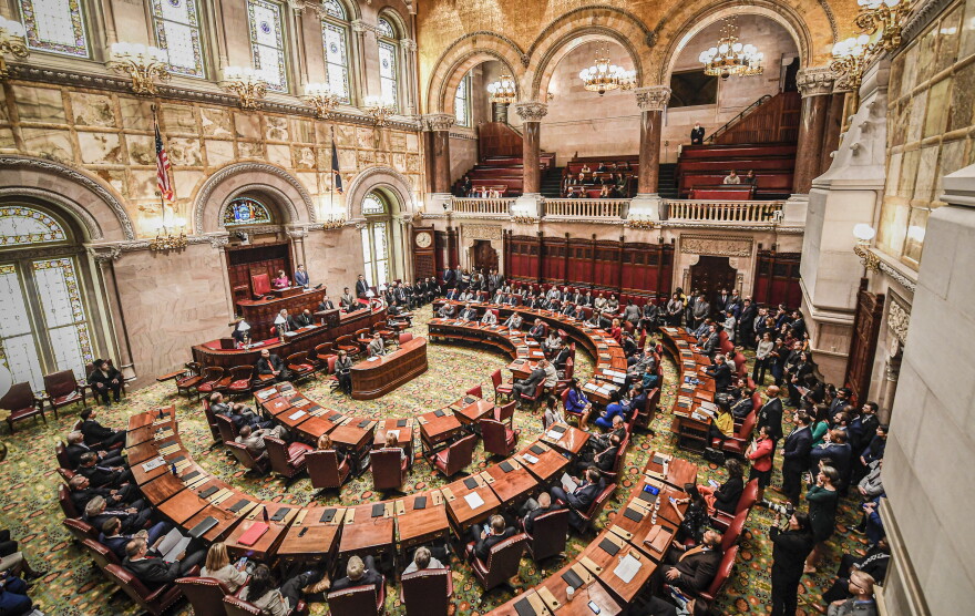 FILE - The New York state Senate meets in the Senate Chamber on the opening day of the legislative session at the state Capitol in Albany, N.Y., on Jan. 8, 2020. New York's legislature has voted to pass new congressional district maps that will expand Democrats' influence in New York politics for years to come. (AP Photo/Hans Pennink, File)