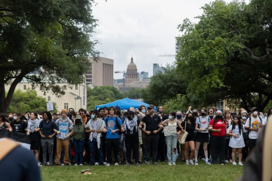 Protesters link arms at the University of Texas at Austin during a pro-Palestine demonstration on April 24, 2024.