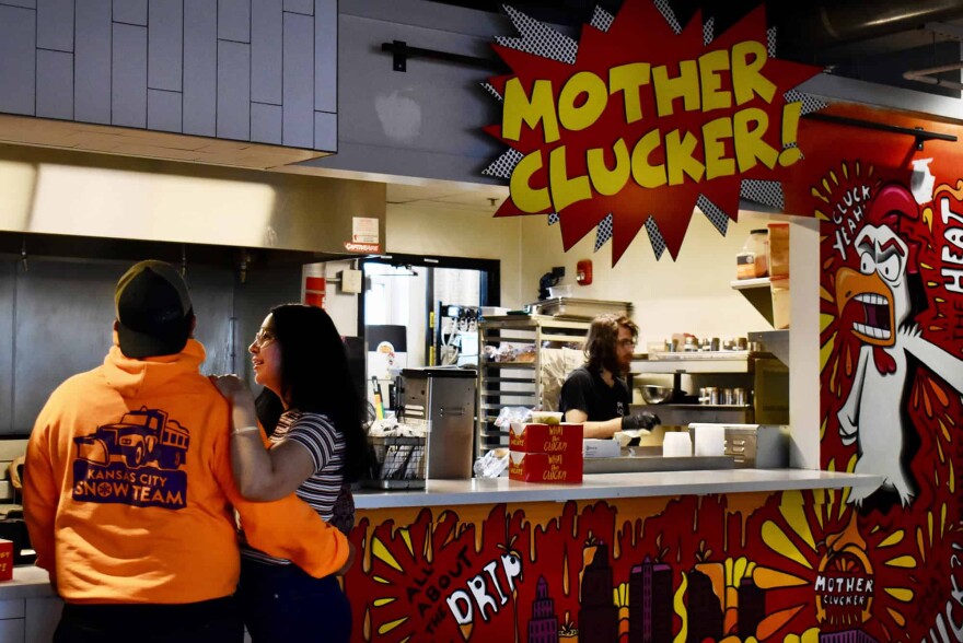 A couple waits at the counter at Mother Clucker inside Parlor KC.