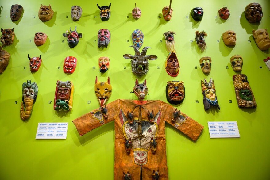 A wall of masks are part of the Ballard Institute and Museum’s exhibit Somos Uno: Mexican and Mexican American Puppetry.