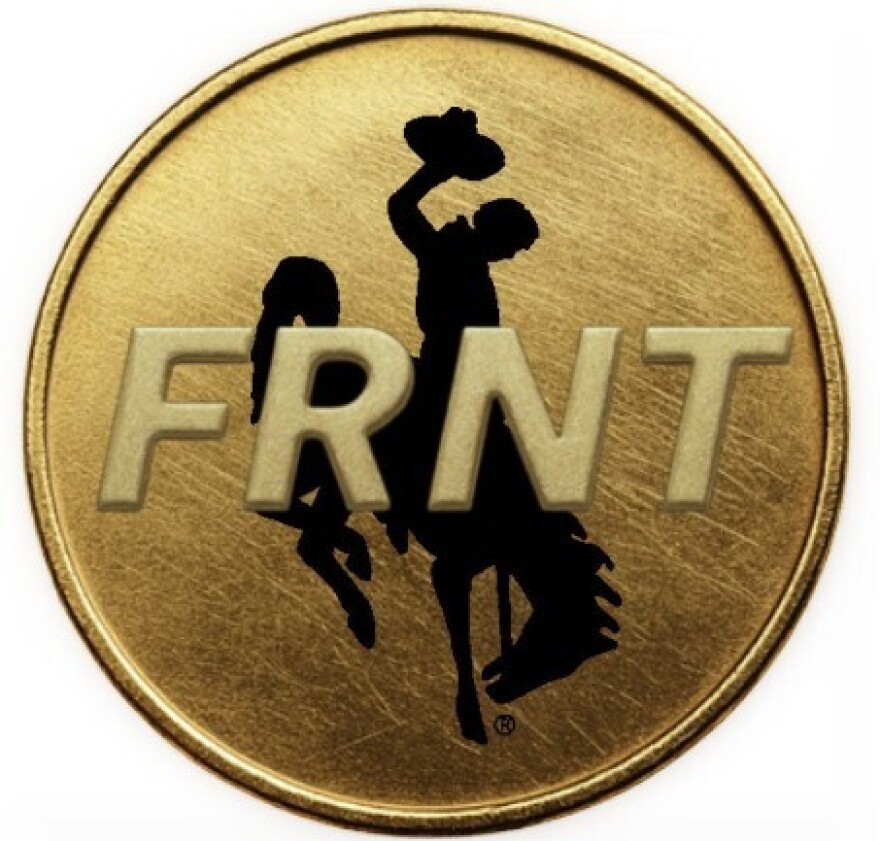 A coin with the Wyoming bucking horse on it and the letters F-R-N-T.