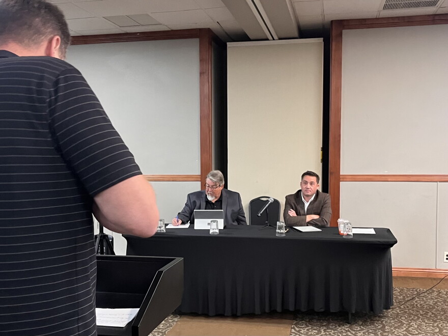 A Laurel resident speaks to a Department of Public Health and Human Services attorney and Board of Investments Executive Director Dan Villa in Billings September 8th.
