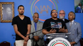 Eric Garner's daughter Emerald Garner and Rev. Al Sharpton (right) speak to the media on August 19, 2019 in New York City. The New York Police Department announced that Officer Daniel Pantaleo has been fired from the force due to his involvement in Eric Garner's death in 2014. (Kena Betancur/Getty Images)