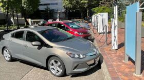 Electric vehicles line up at Downtown Portland's Electric Ave. The space offers EV drivers fast chargers for many different charging ports.