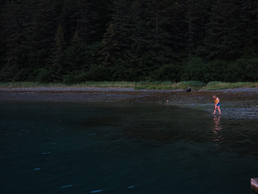 Arete student Danae Sollie takes a brave dip in the chilly waters of the bay.