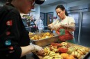 Rosaline Burr (center), program coordinator at Dimitri House, and volunteer Krystina Herdzik prepare for a Thanksgiving lunch to be served the next day for guests at Dimitri House on Tuesday, November 25, 2025. Dimitri House provides outreach to people experiencing poverty and homelessness in Rochester through its food cupboard and hot lunch program, both of which have seen an increase in demand over the past year.