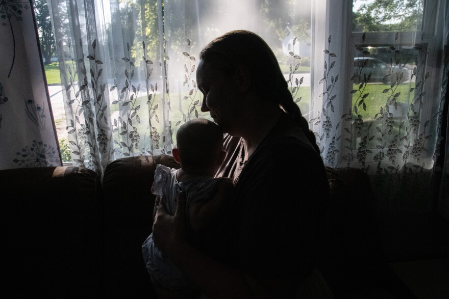 Natalie Krueger of Osmond, Nebraska, says she felt pressured into an epidural she did not want when she delivered her first child at a hospital. Her next child was born at home without assistance from medical providers. This year, Krueger had her second free birth with the arrival of her daughter, Aurora, in April.