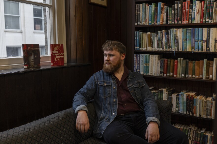 Andy Clarke, a local historian and blogger behind the Tanistry Instagram account, poses for a portrait at The Linen Hall library in central Belfast, Northern Ireland, on Feb. 9.