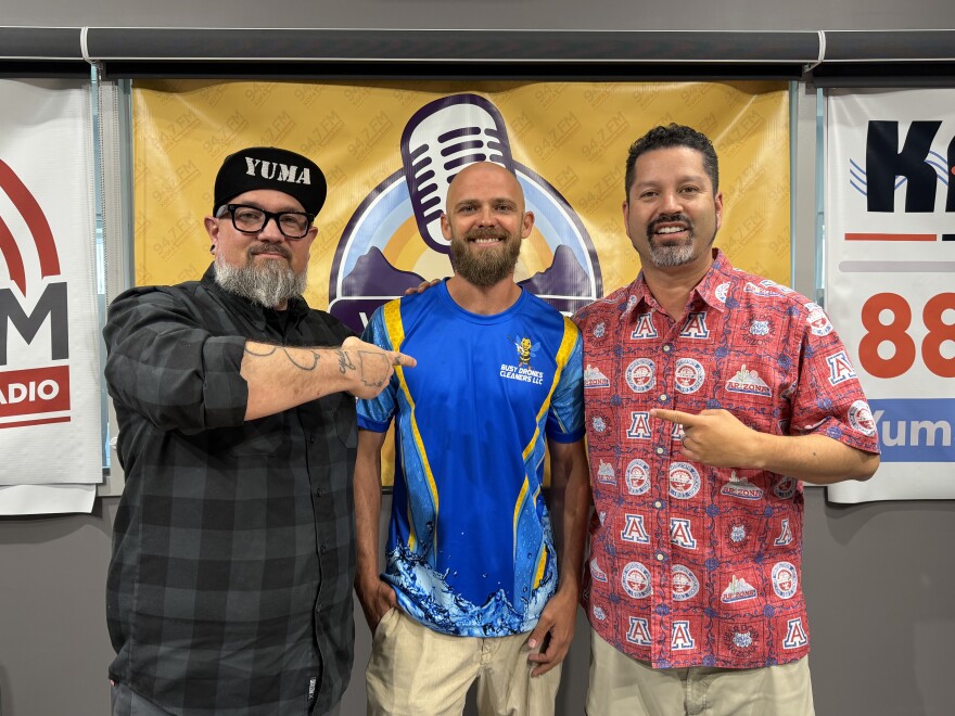 John Peel. owner of Busy Drones Cleaners LLC, center, with What's Up Yuma? Radio hosts Jonny Porter and Victor Calderón.