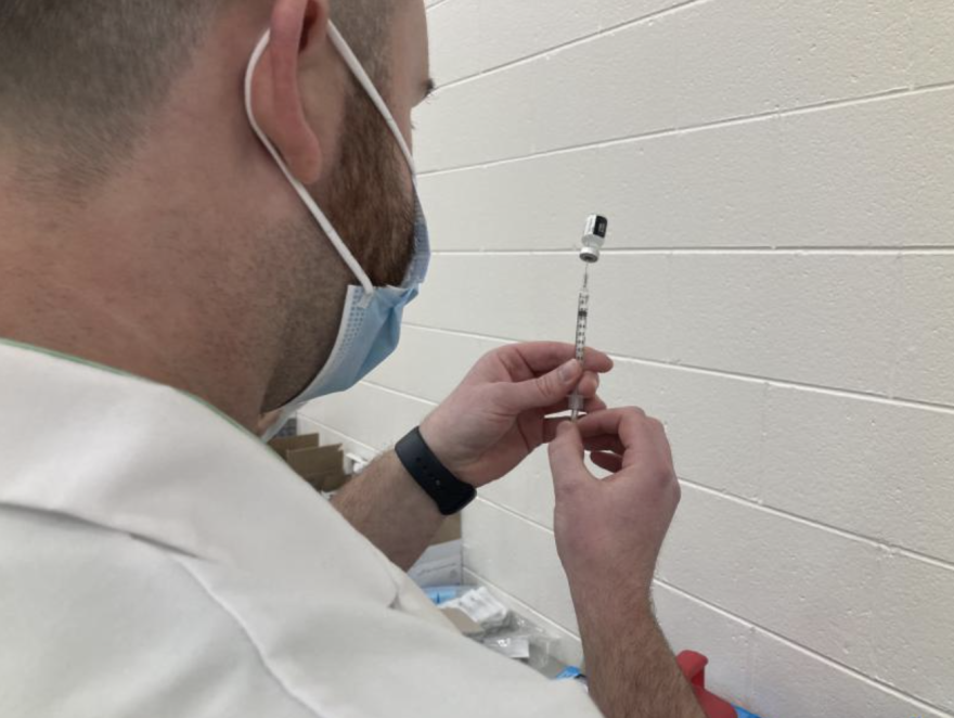 Preparing syringe at Columbus vaccine clinic