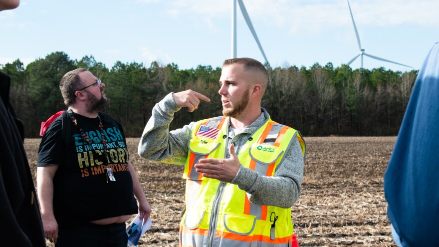 Timbermill Wind site manager Tyler Finley takes middle schoolers on a tour of the wind farm in Chowan County.