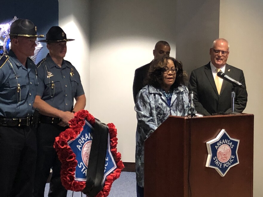 Dr. Wynona Bryant-Williams, whose husband Trooper Louis Bryant was killed in the line of duty in 1984, addresses family and friends of fallen state troopers at the Arkansas State Police headquarters in Little Rock.