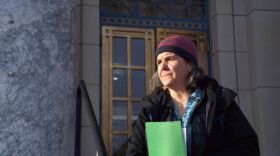 Janet Neilson stands on the steps of the Alaska State Capitol building