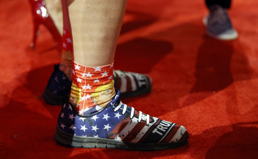 A delegate wears Trump-themed socks and shoes during the session at the Fiserv Forum for the Republican National Convention in Milwaukee, Wis., Tuesday, July 17, 2024. (Ashleigh Lucas/WUFT News)