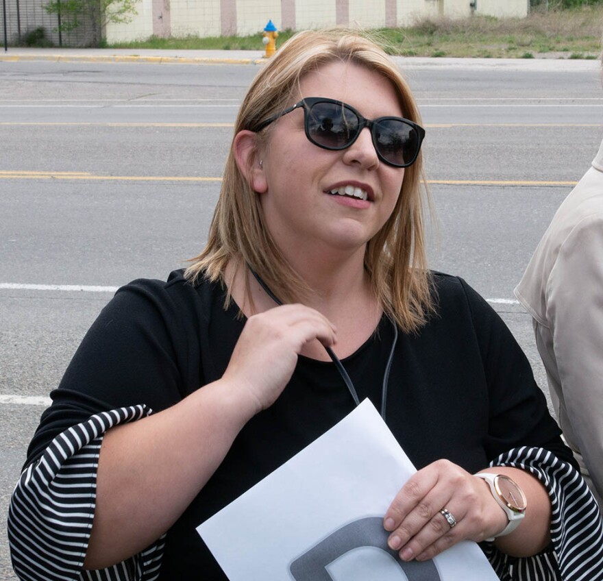 Selene Koepke stood with friends and co-workers during the welcome home procession for trooper Wade Palmer, May 22, 2019. Koepke and friends each held a letter spelling out "Welcome Home Wade!"