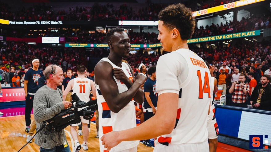 Jesse Edwards (14) and John Bol Ajak chat after Syracuse's 75-72 win over NC State on Tuesday