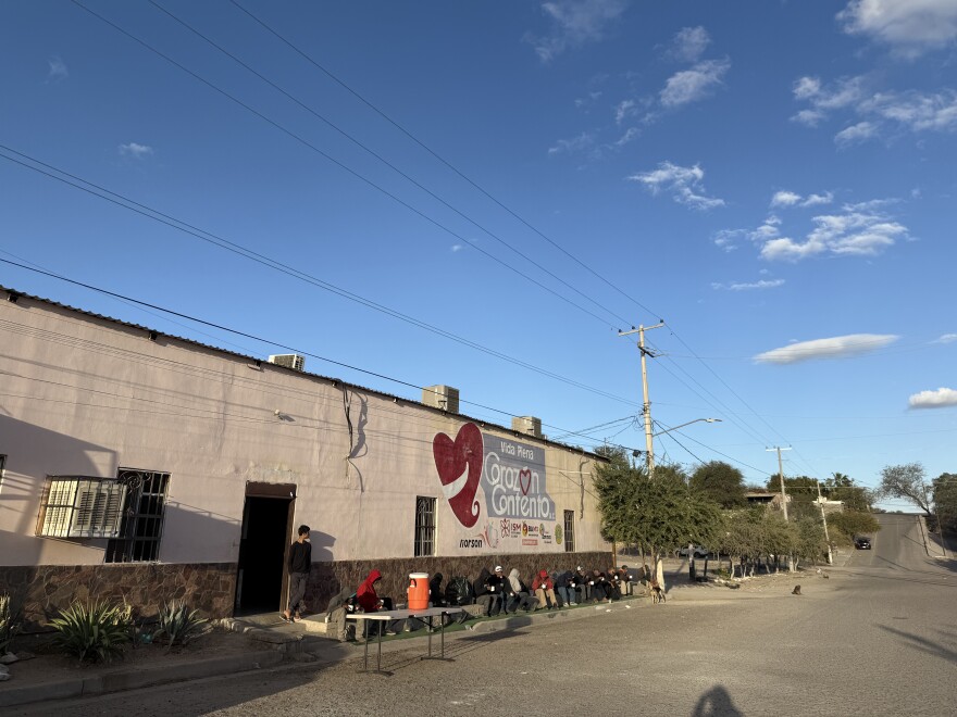 People in need in Hermosillo eat dinner outside the Vida Plena Corazón Contento soup kitchen. This nonprofit also doubles as a migrant shelter.