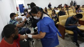 Dengue patients receive treatment in a provisional clinic in the Santa Maria neighborhood of Brasilia, Brazil, Tuesday, Jan. 23, 2024.