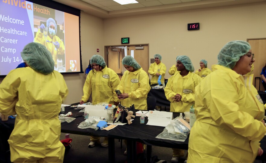 Campers had to wear personal protective equipment in order to participate in the pharmacy simulation.