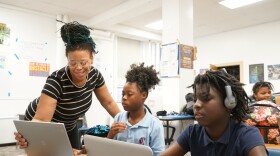 Monique Hines (left) teaches Janiaya Hubbard (middle) and Taniah Woods (right) the basics of music production.