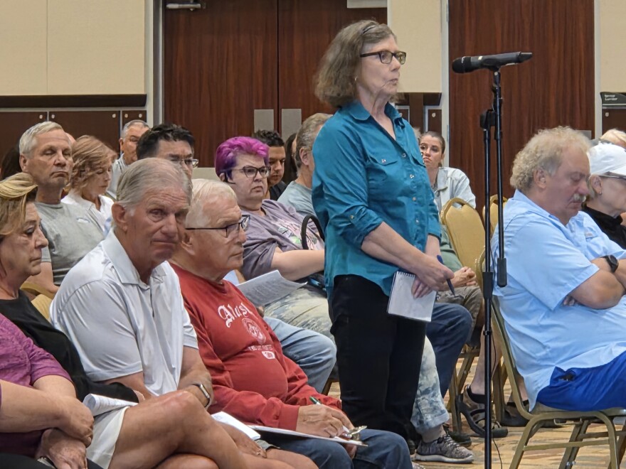 Susan Whelan takes the mic during the question and answer period of the city of Bemidji and Northern Township's joint meeting on Aug. 28, 2025. The hearing was a required part of the two local govenrments' admistrative trial that begins later in September.